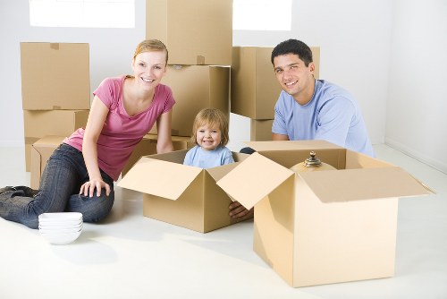 Modern office workspace being carefully relocated by professionals