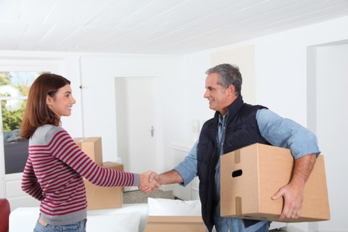 Professional movers handling items with care in Earls Court