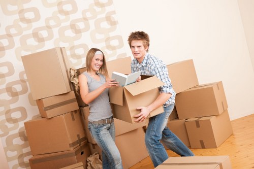 Experts handling fragile valuables during packing